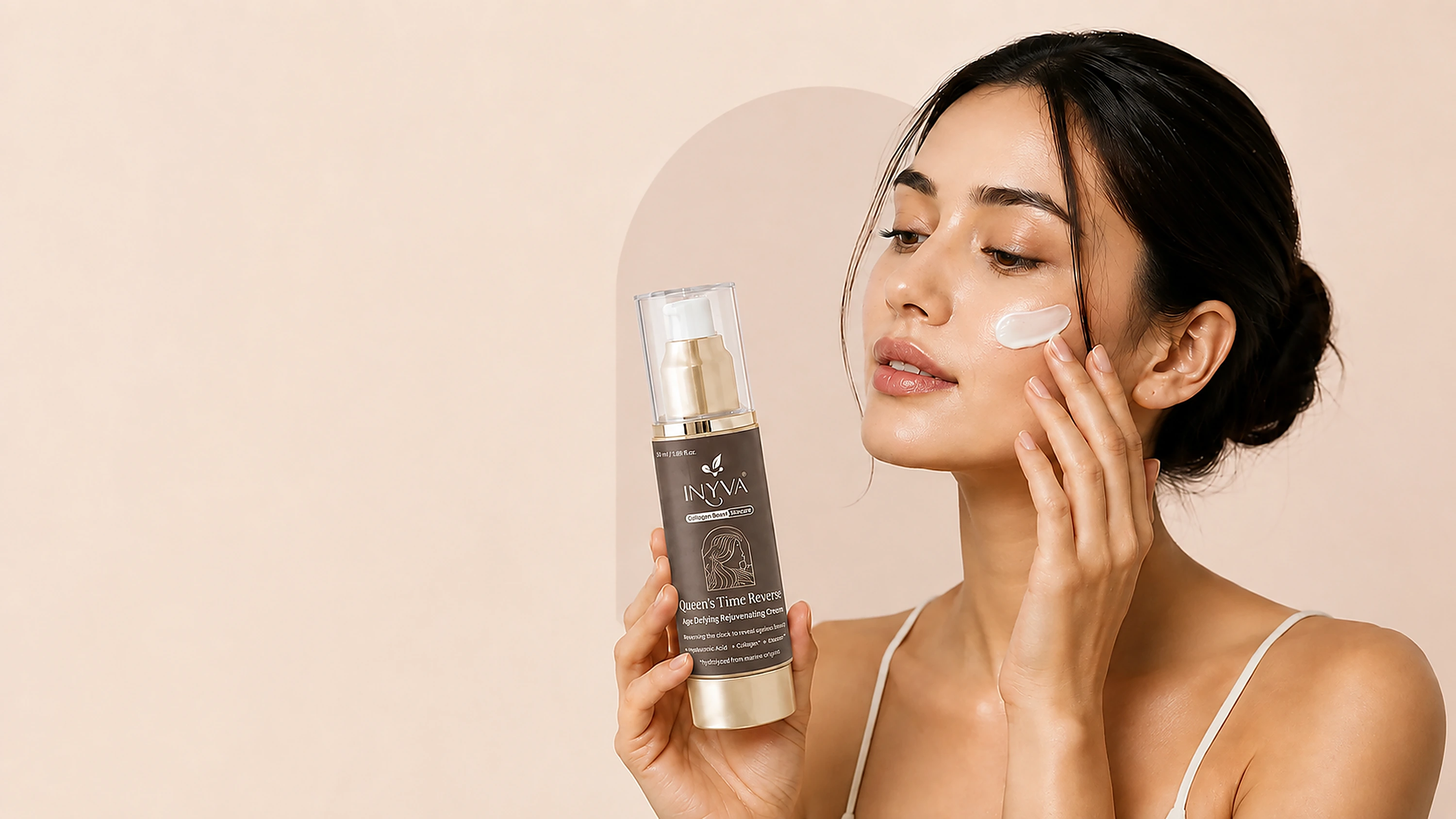 INYVA Queen's Time Reverse Age Defying Rejuvenating Cream, held up to the light